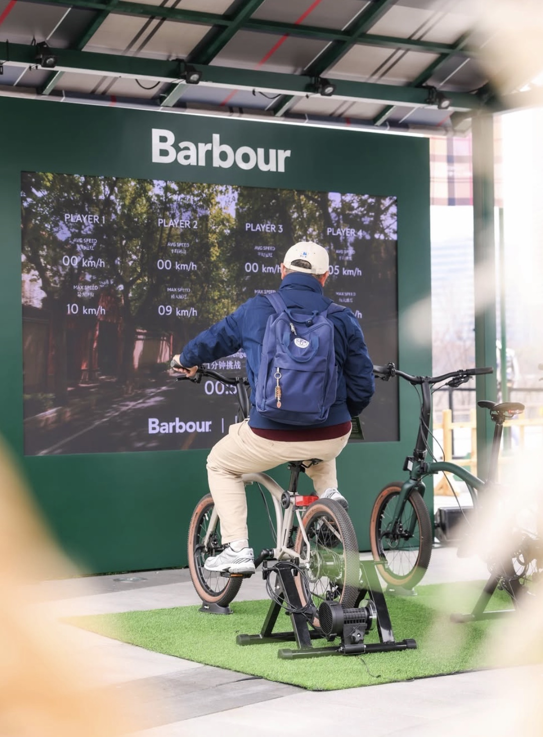 Visitor taking part in the Barbour cycling activation