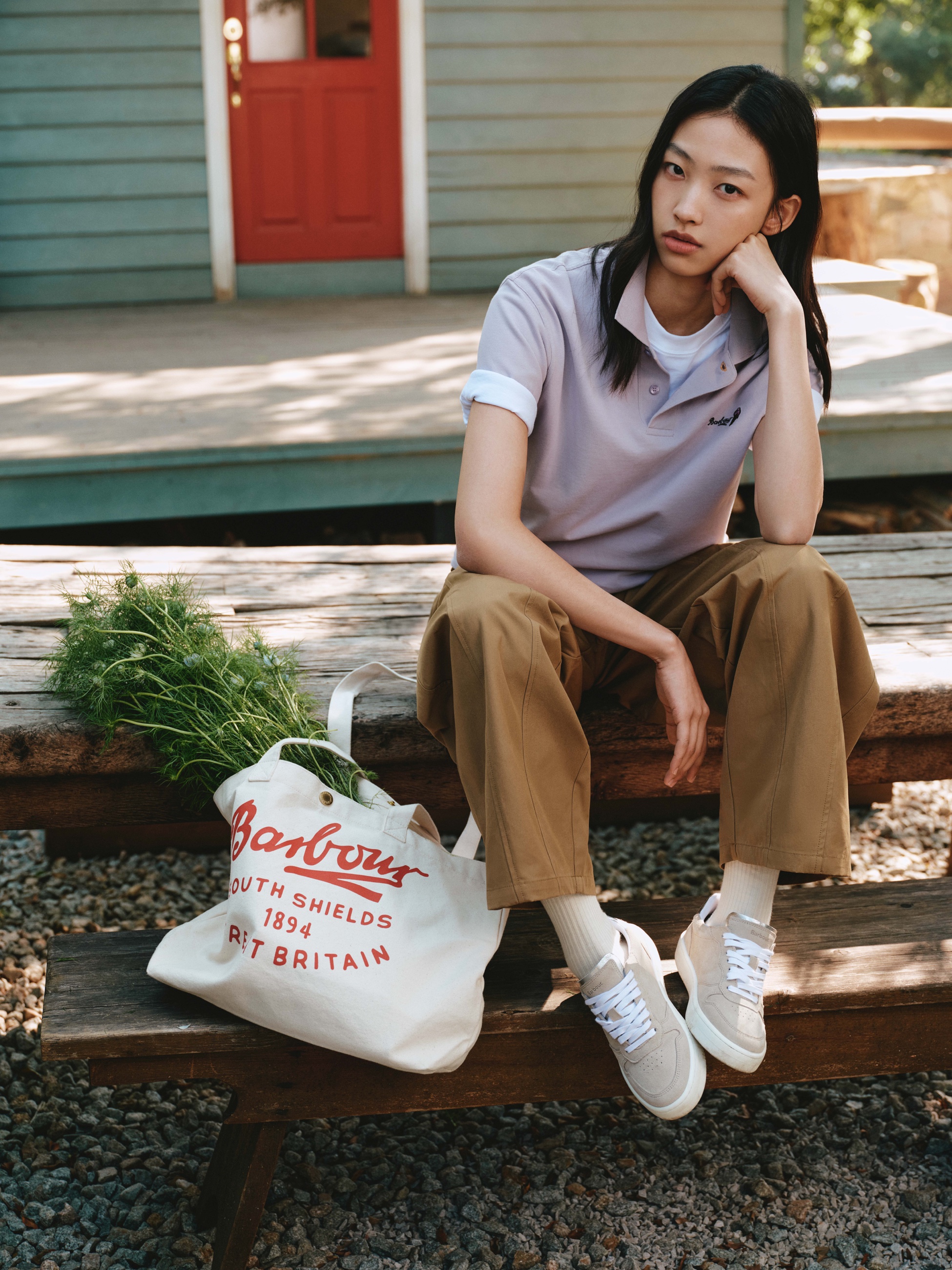 Barbour SS26 woman wearing a polo shirt