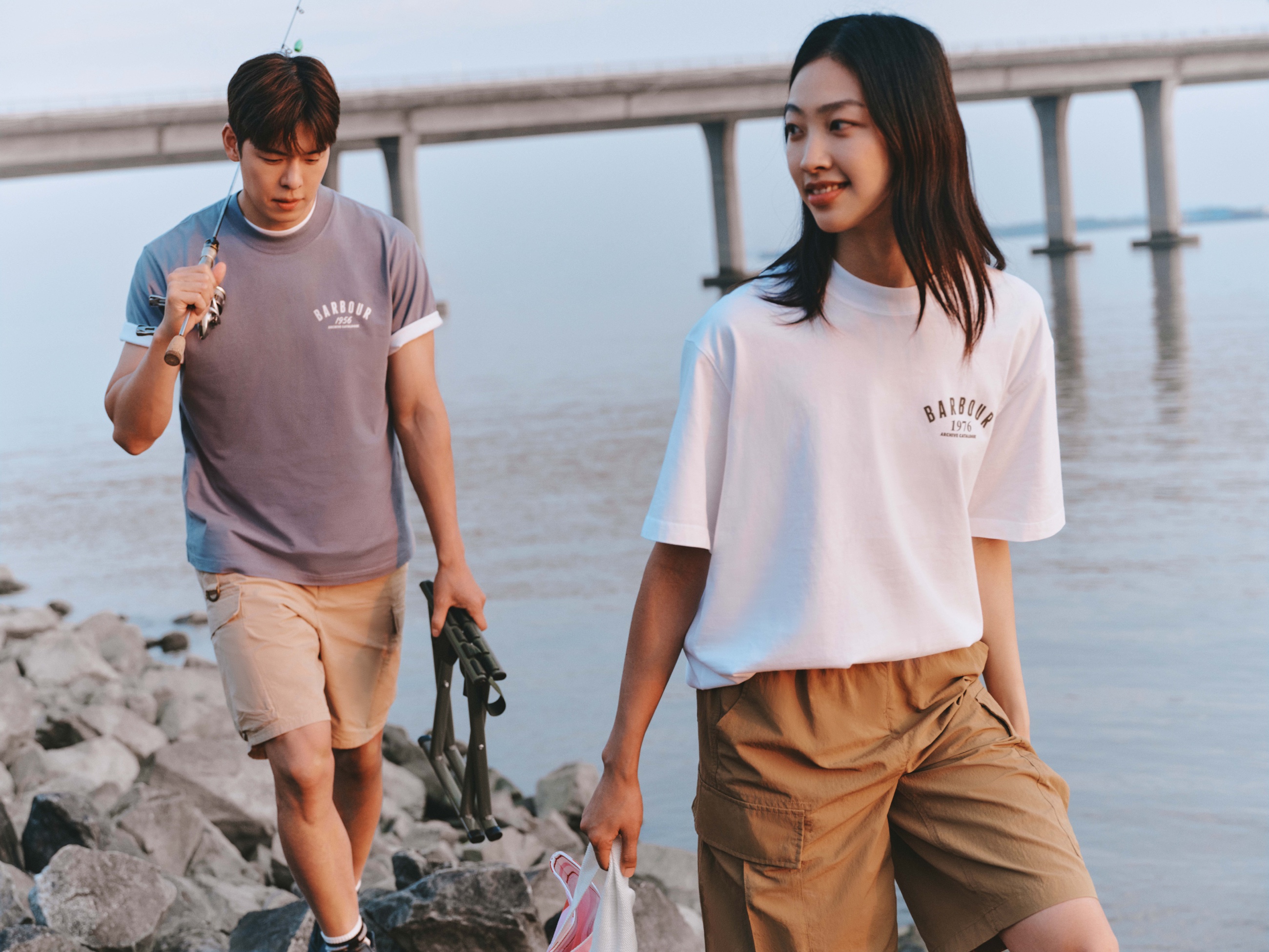 Barbour SS26 campaign with two models by the water