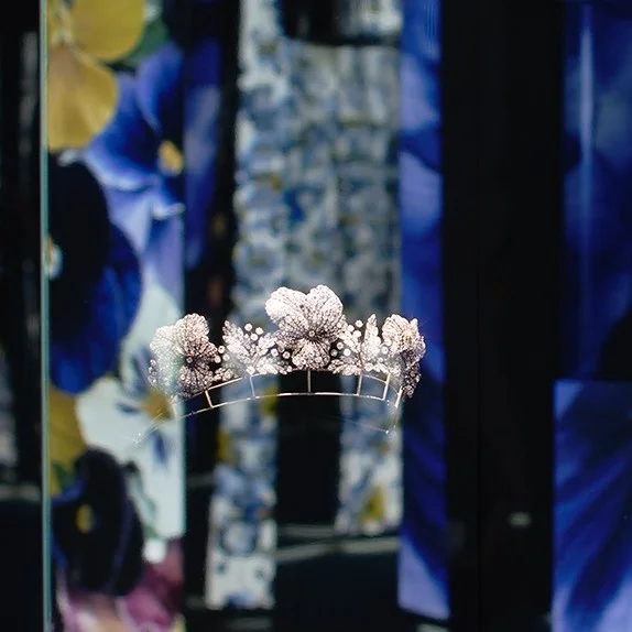 Chaumet botanical tiara displayed within the immersive installation