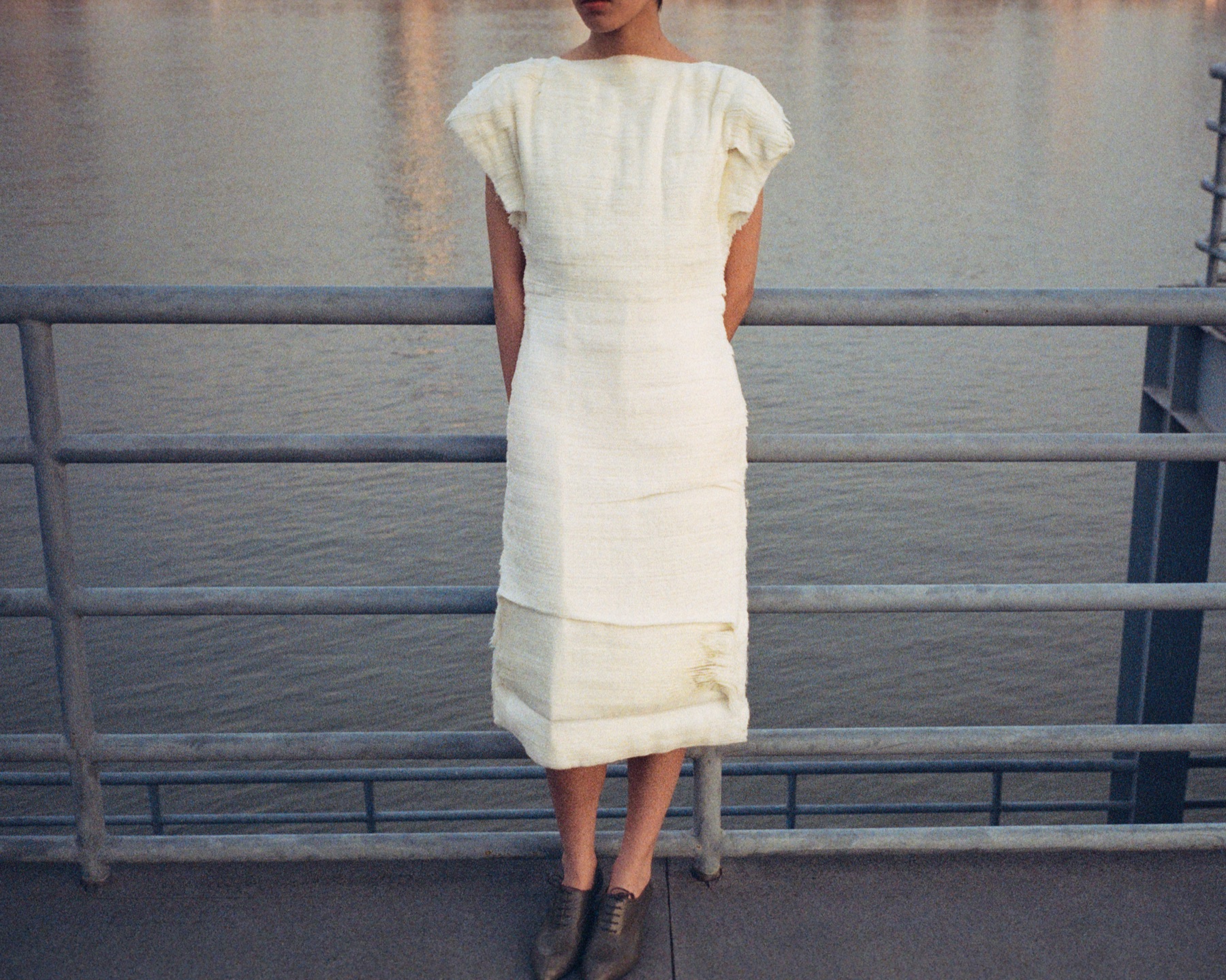 Jil Sander Lunar New Year campaign white dress by the water