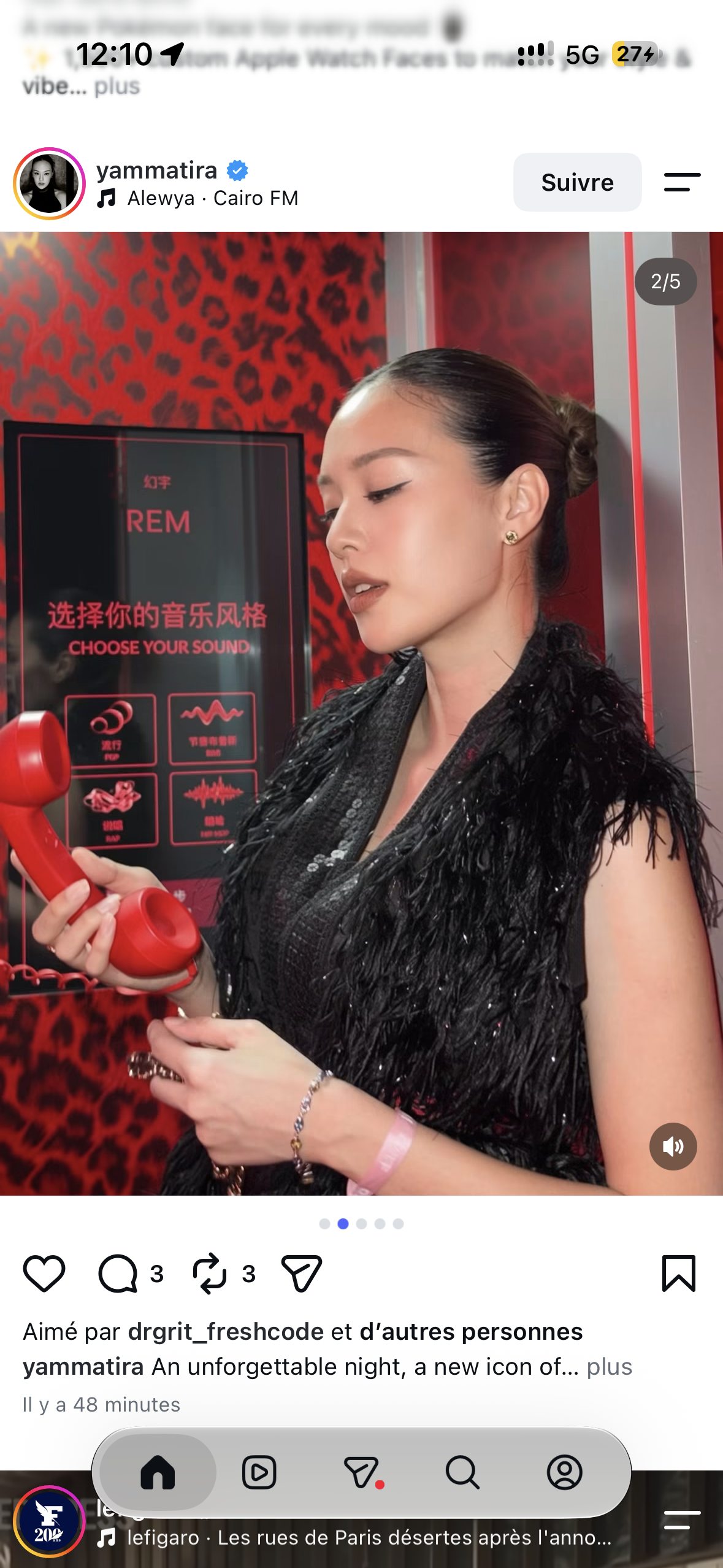 A guest in profile holding the red Dream Line receiver