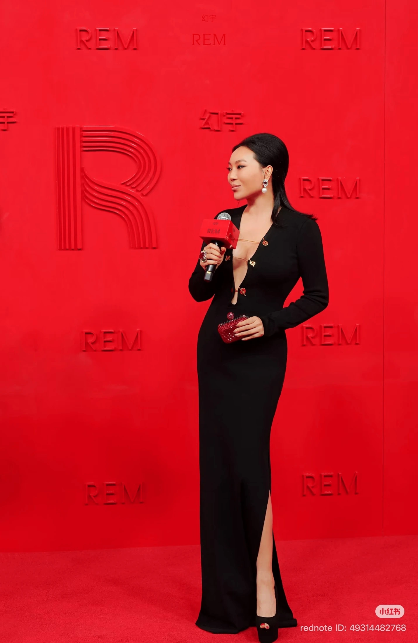 A guest being interviewed on the REM red carpet