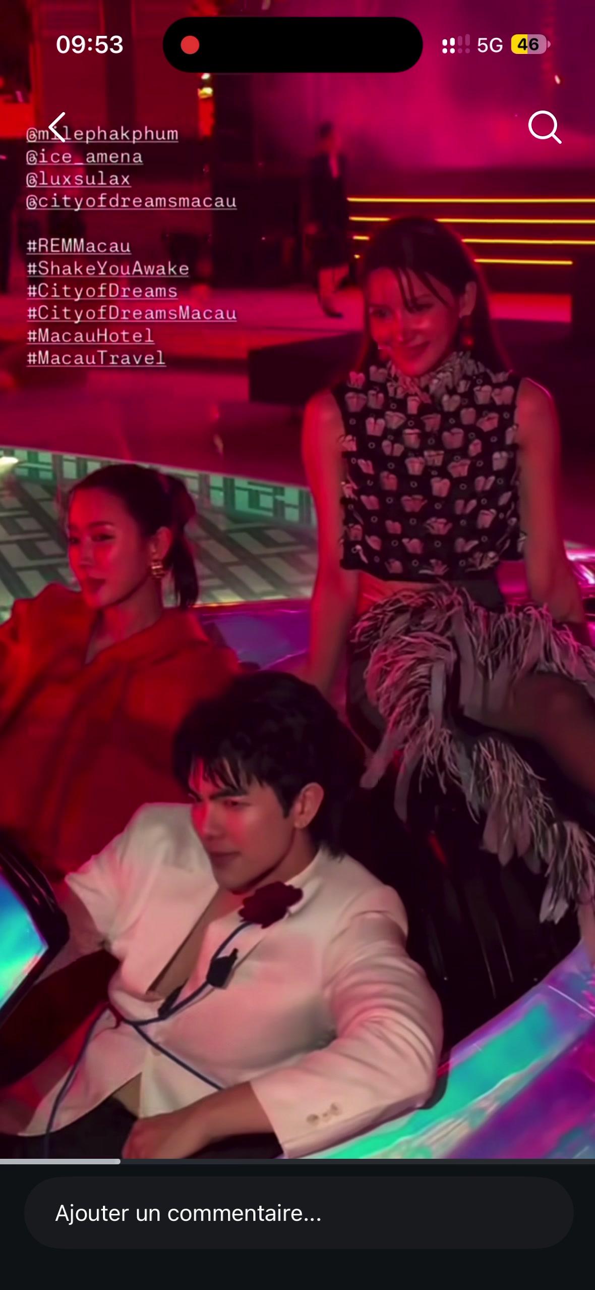 Three guests inside the iridescent REM dream car, with the driver, rear passenger and standing guest all visible