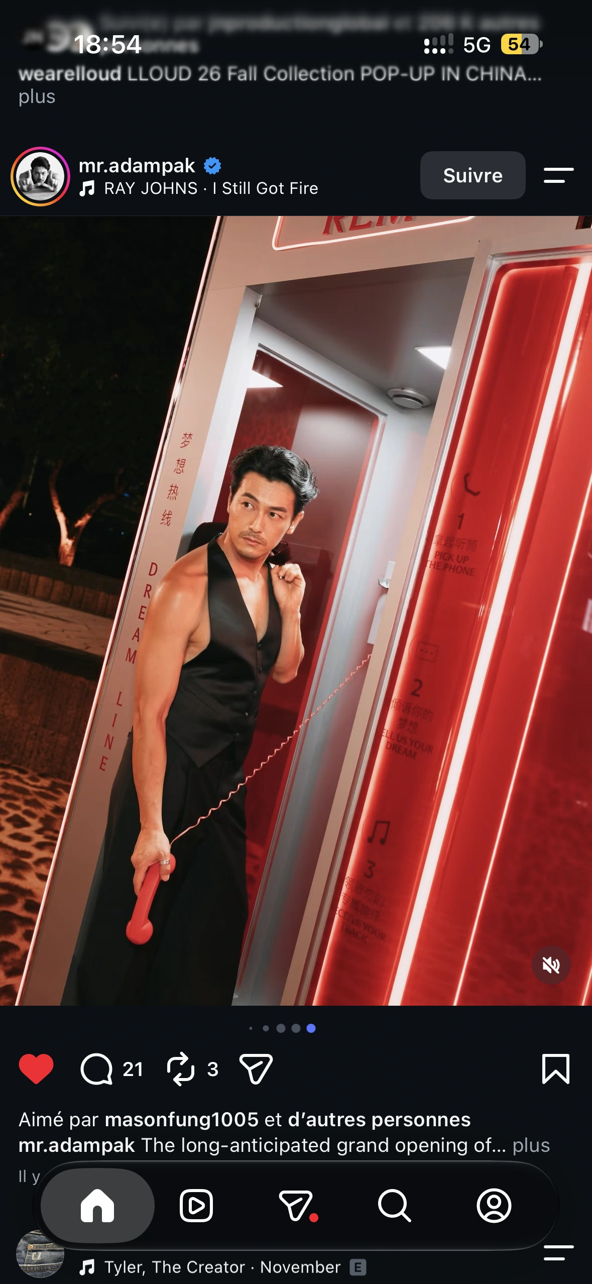 A guest in a black waistcoat holding the red receiver inside the Dream Line booth