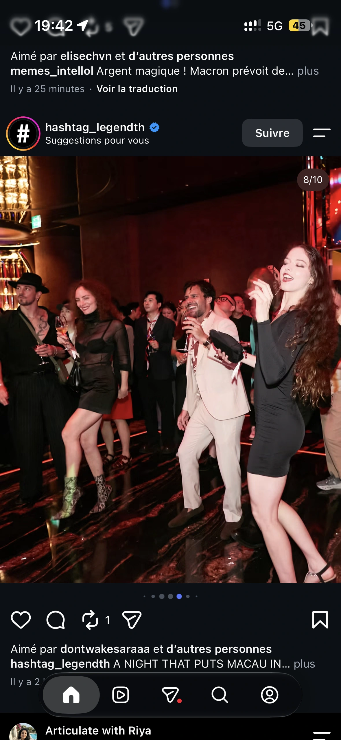 Guests dancing and laughing together inside the red and mirrored REM party setting