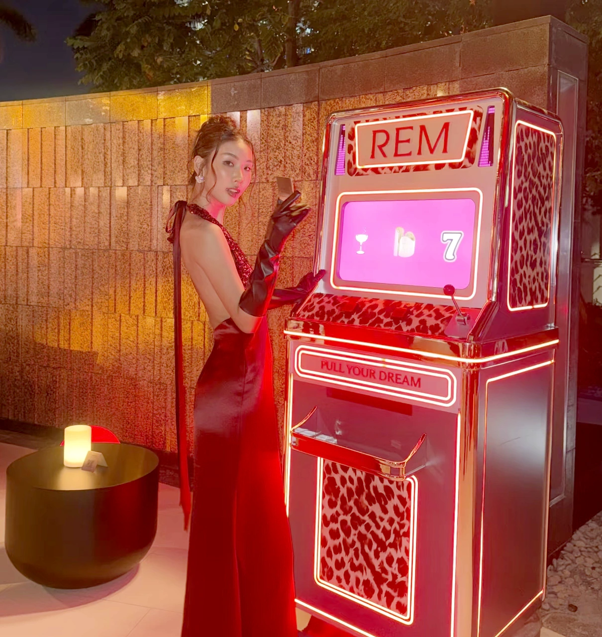 The realised red and leopard-print Pull Your Dream machine with a guest on opening night