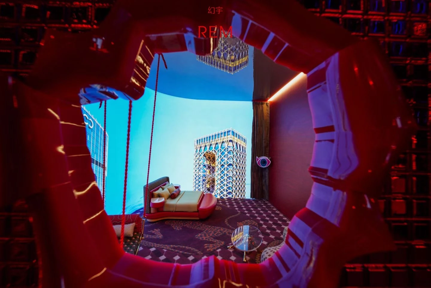 The realised miniature hotel interior viewed through a surreal circular opening