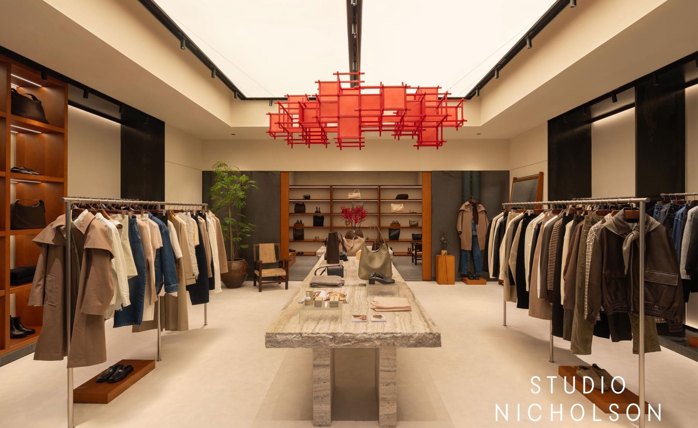 Studio Nicholson boutique with a red suspended retail installation